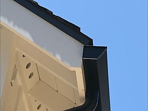 Black fascia with black round downspout, Irvine, CA